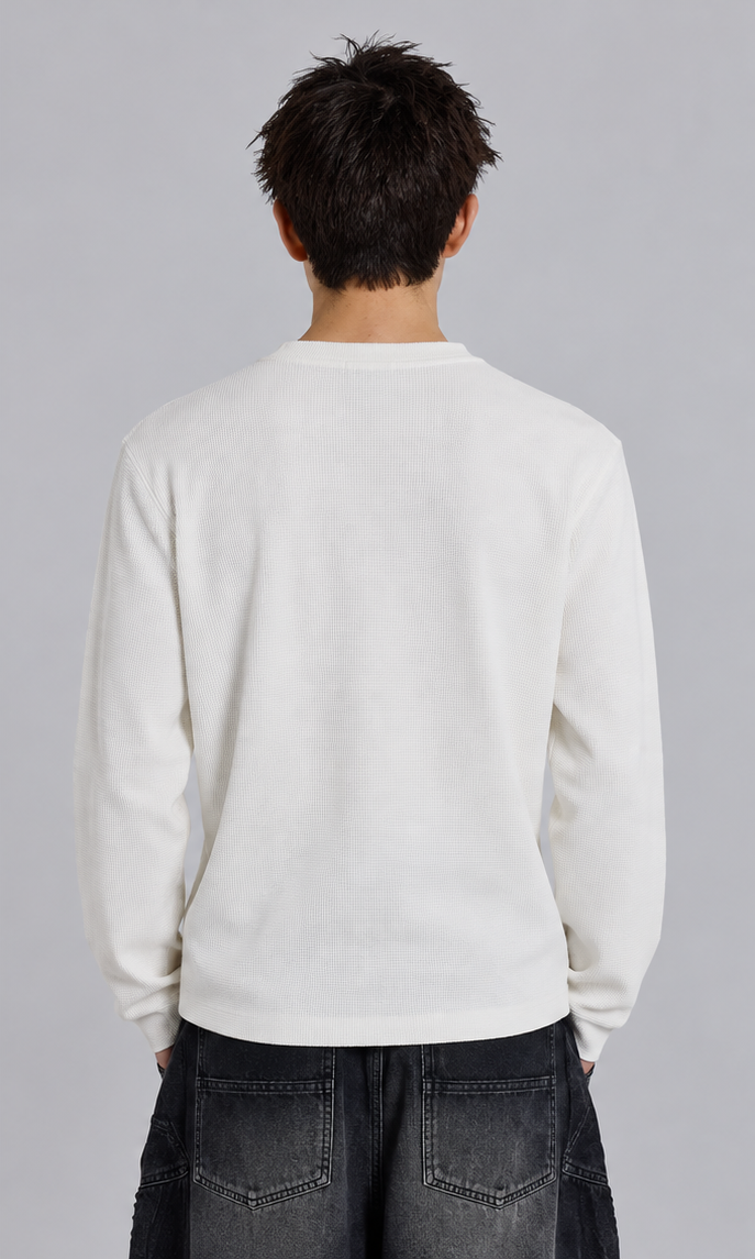 Back view of plain white COMME des LORDES long-sleeve top