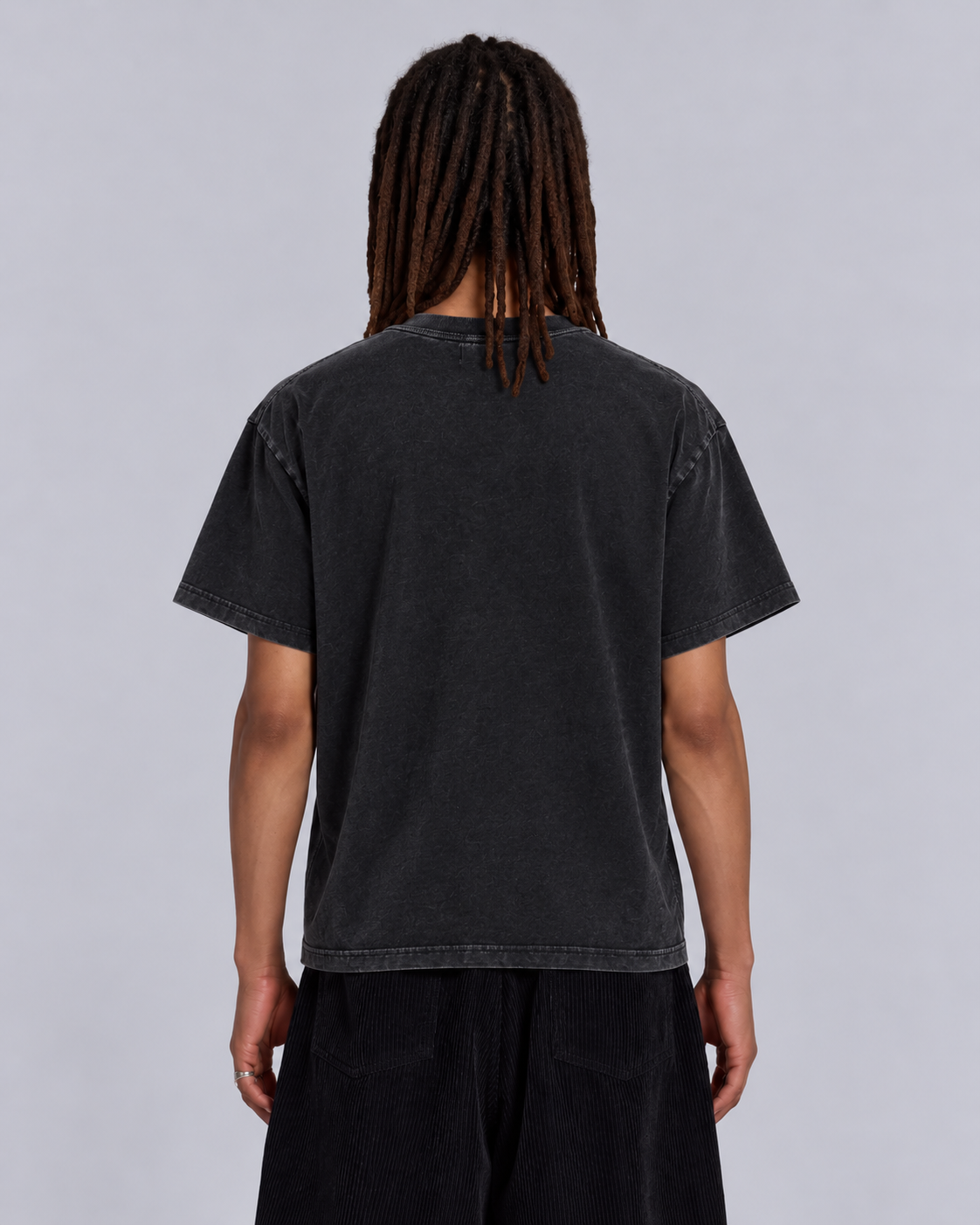 Back view of black COMME des LORDĘS short-sleeve tee